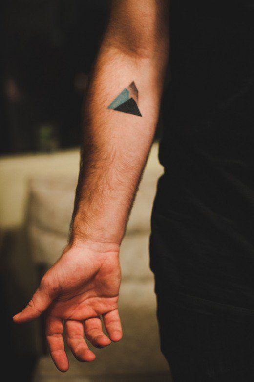 Minimalist fine-line forearm tattoo