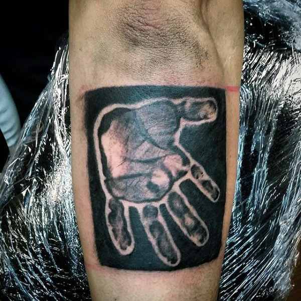 Baby Hand Holding Finger Tattoo