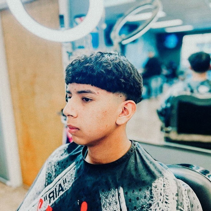 Curly Edgar Haircut with a Faded Undercut