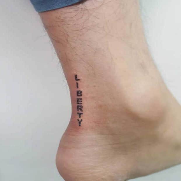 Minimalist Liberty Word Tattoo