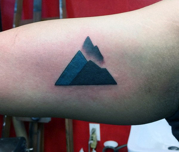 Small symbolic tattoo with minimalist design